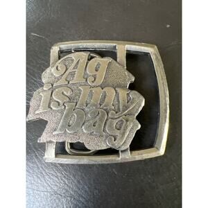 Reman‎ Publications AG is My Bag belt silver buckle OS